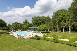 an image of a swimming pool in a garden at Château Du Mont Joly in Sampans