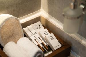 a drawer in a bathroom with toothbrushes and towels at ananea Hurghada - Adults Only in Hurghada