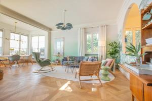 a living room with chairs and a table at Lake House Lesa - Lakeside Villa Lago Maggiore in Lesa