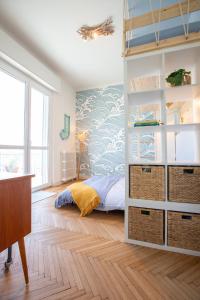a bedroom with a bed and a book shelf at Lake House Lesa - Lakeside Villa Lago Maggiore in Lesa +26 photos