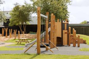 a playground with a slide in a park at Scandic Hvidovre in Hvidovre