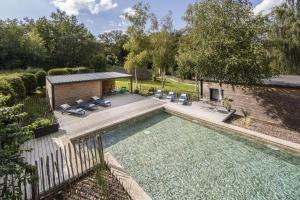 an overhead view of a swimming pool in a backyard at chalets 4 - les jolis chalets in Barbey-Séroux