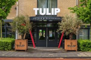 a front entrance to a hotel andresessions at TULIP Hotels & Residences - Zwolle in Zwolle
