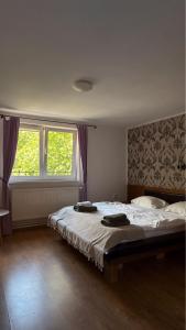 a bedroom with a bed with two towels on it at Marginimea Sibiului - Pensiunea Darian & David in Orlat +233 photos