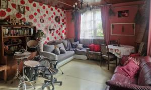 a living room with a couch and a table at Bungu Bangu in Ventspils
