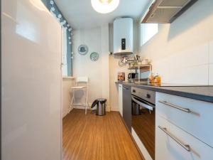 a kitchen with a sink and a counter top at La Chaussee in Bernay +23 photos