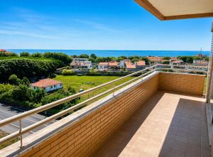 a balcony with a view of a city at PORTO AGUDA BEACH ***** in Arcozelo