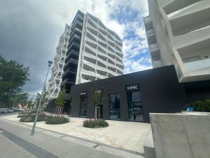 a building on a street in front of a building at Sleep & coffee by KAFEC in Komárov