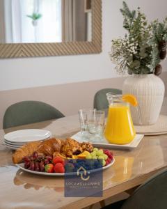 a plate of food on a table with a plate of fruit at Chalfont Haven in Latimer