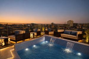 a swimming pool on the roof of a building at La Terrasse Hotel in Jeddah