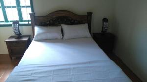 Una cama o camas en una habitación de Hotel Villa San Rafael - Zaranda INC