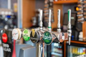 a row of parking meters in a coffee shop at North Stafford Hotel in Stoke on Trent +12 photos