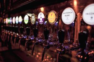 a bunch of wine bottles lined up in a bar at Market Square in Monasterevin