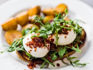 a plate of food with eggs and greens on it at Market Square in Monasterevin +27 photos