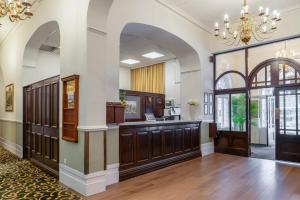 a large lobby with an entry way with a chandelier at North Stafford Hotel in Stoke on Trent