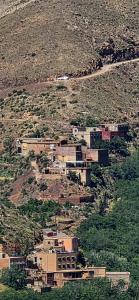 a group of houses on top of a mountain at Auberge amazrane in Matat