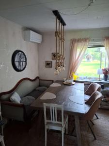 a living room with a table and a couch at Bieber`s Gästezimmer in Lilla Norge +15 photos