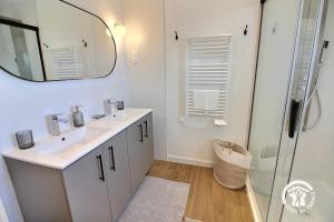 a bathroom with a sink and a mirror and a shower at Enez bihan in Plougrescant +35 photos