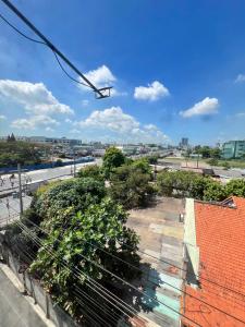 a view of a city from the roof of a building at Khách Sạn Vũ Nam Hưng in Ấp Hưng Lộc