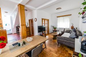 a living room with a couch and a table at Late Story in Podgorica