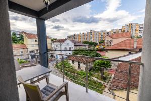 a balcony with a view of a city at Late Story in Podgorica