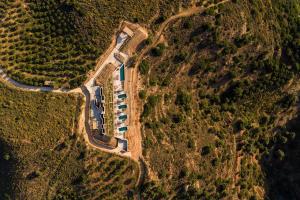 an aerial view of a road in a field at Elysium Caved Villas - Carved From Calm by etouri in Heraklio