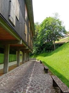 a building with benches on the side of a street at Appartamento con vista sul Cimone in Fiumalbo