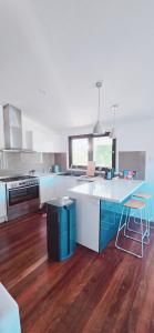 a kitchen with a counter and a table in it at Perth property - Heritage Charm Meets Modern Ease close to all amenities including Midland Hospital in Midland Junction
