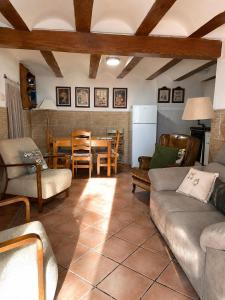 a living room with a couch and a table at La Casonita in Alpuente