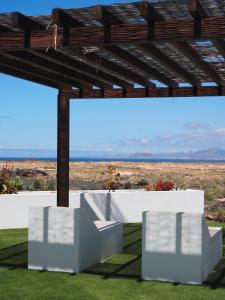 a view from the roof of a house with a large screen at Fuerte Wave House in Lajares