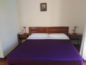 Rúm í herbergi á Albergo Bandoni