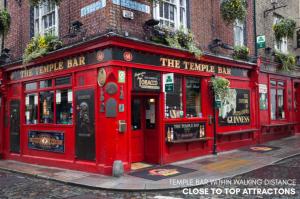 a red pub on the corner of a street at Destiny Student - Parkgate in Dublin