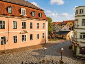 an empty street in a town with buildings at Pension am Markt in Wurzen