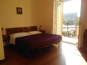 Rúm í herbergi á Albergo Bandoni