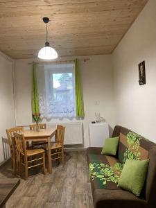 a living room with a table and a couch at Veselka in Seč