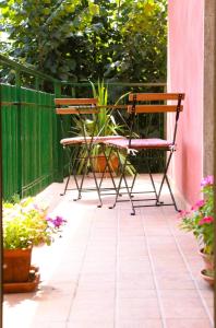 a pair of chairs and a table on a patio at CASA IUCCI Langhe Monferrato in Canelli