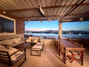 a dining room with a view of the water at Merry Land Hotel & Roof Top Nile Restaurant Luxor in Luxor