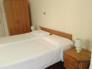 Rúm í herbergi á Albergo Bandoni