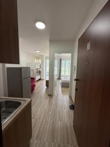 a kitchen with a sink and a counter top at Shengjin Apartment in Lezhë