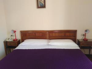 Rúm í herbergi á Albergo Bandoni