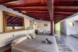 a bedroom with a large bed in a room at Oaxaca Puma in Agaete