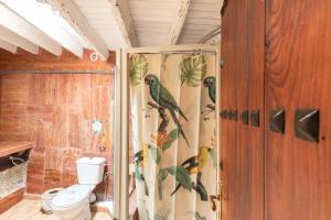 a shower curtain with birds on it in a bathroom at Oaxaca Puma in Agaete +22 photos