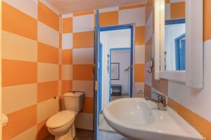 a bathroom with a toilet and a sink at Oaxaca Iguana in Agaete +17 photos