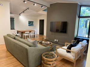 a living room with a couch and a table at Twice Central Guest House in Stellenbosch