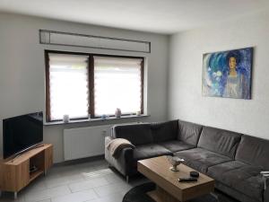 a living room with a couch and a coffee table at Ferienwohnung Mosel in Piesport