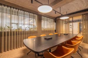 a conference room with a table and chairs at Green Hotel in Genk