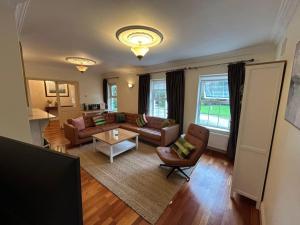 a living room with a couch and a table at The Sanctuary in Killavullen