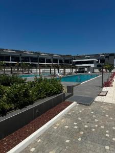 a swimming pool in a large building with a resort at Mertcan Doruk in Side