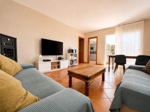 a living room with a couch and a coffee table at Casa VEROLES in Tías +18 photos