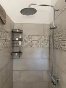 a shower with a glass door in a bathroom at Ca' Salino in Villa Inferno